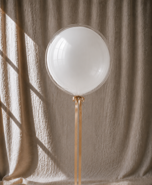 Champagne Pearl bobo — pearl-white balloon, champagne ribbon, POP Studio Auckland